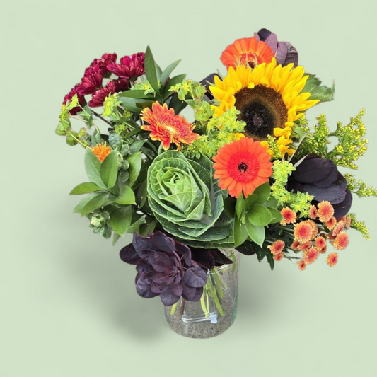 Herfstboeket “Zonnige Touch” – rood, oranje & groen met zonnebloem
