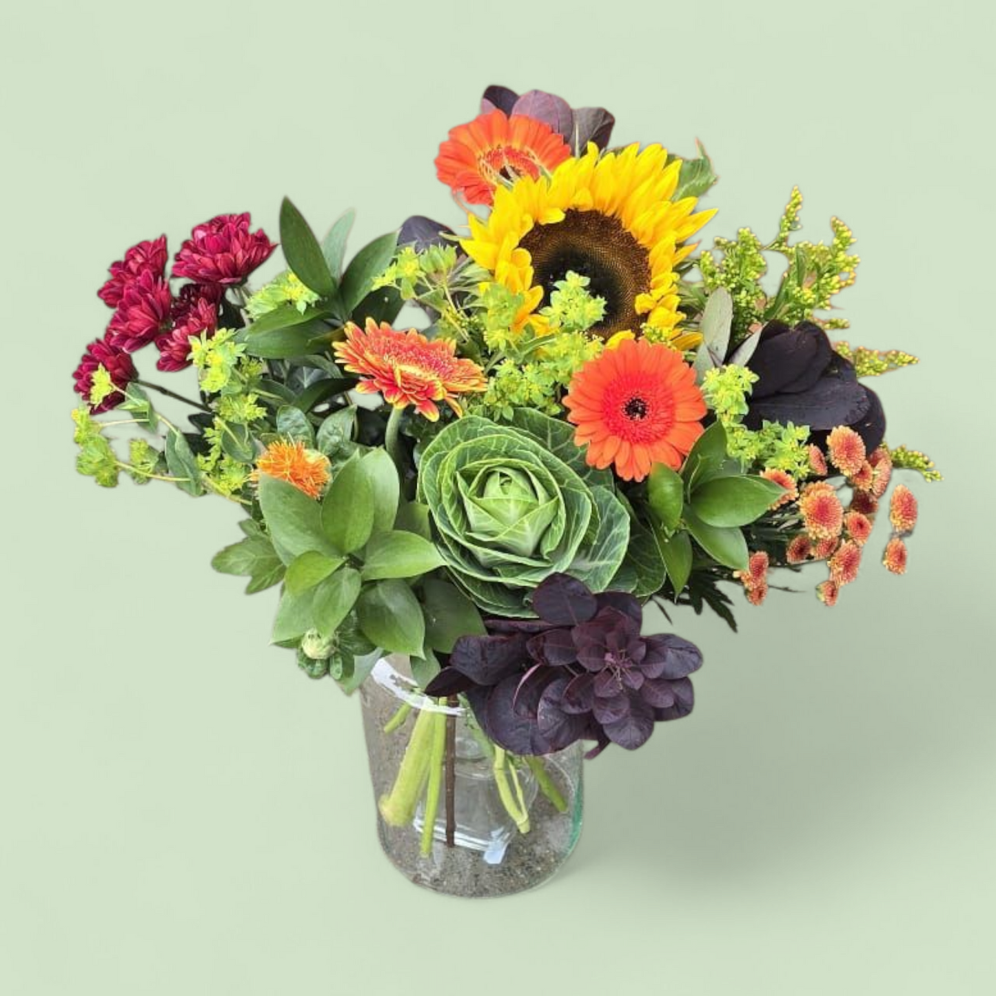 Herfstboeket “Zonnige Touch” – rood, oranje & groen met zonnebloem