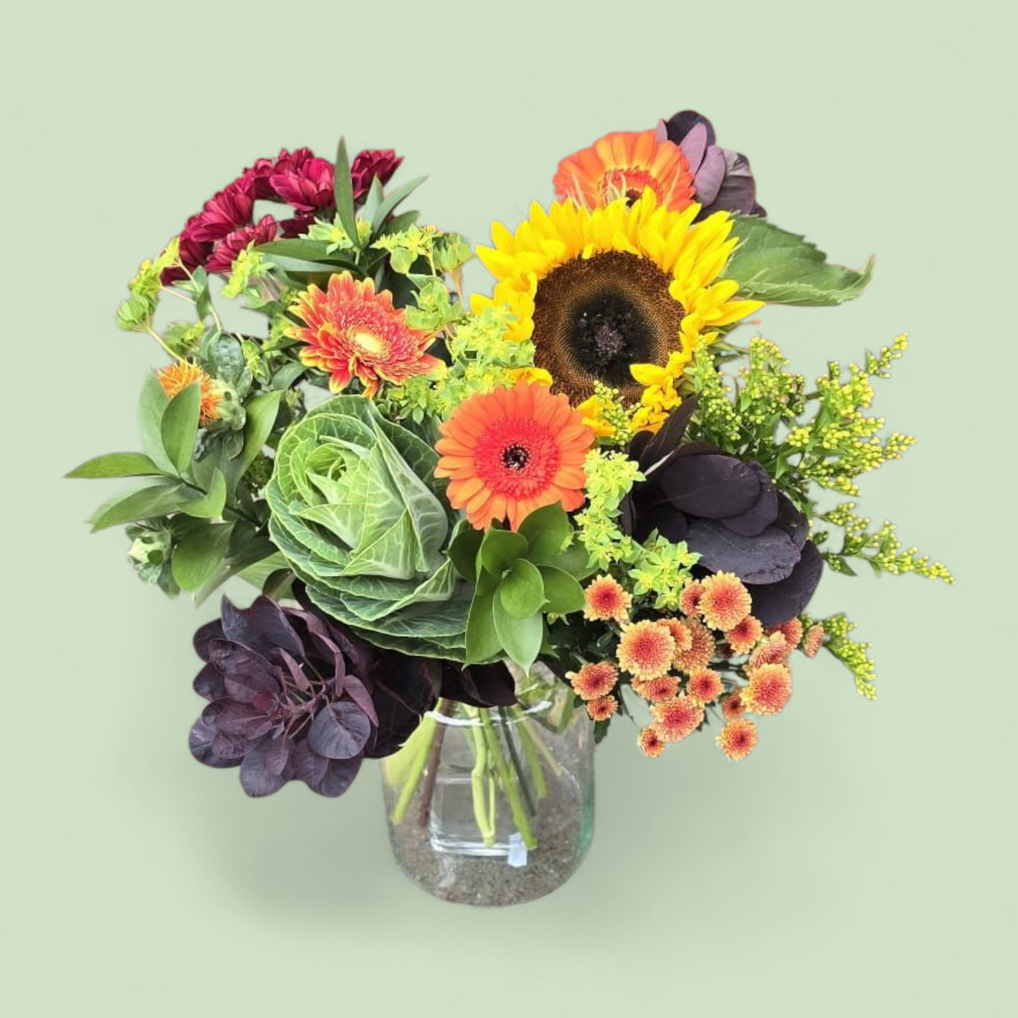Herfstboeket “Zonnige Touch” – rood, oranje & groen met zonnebloem