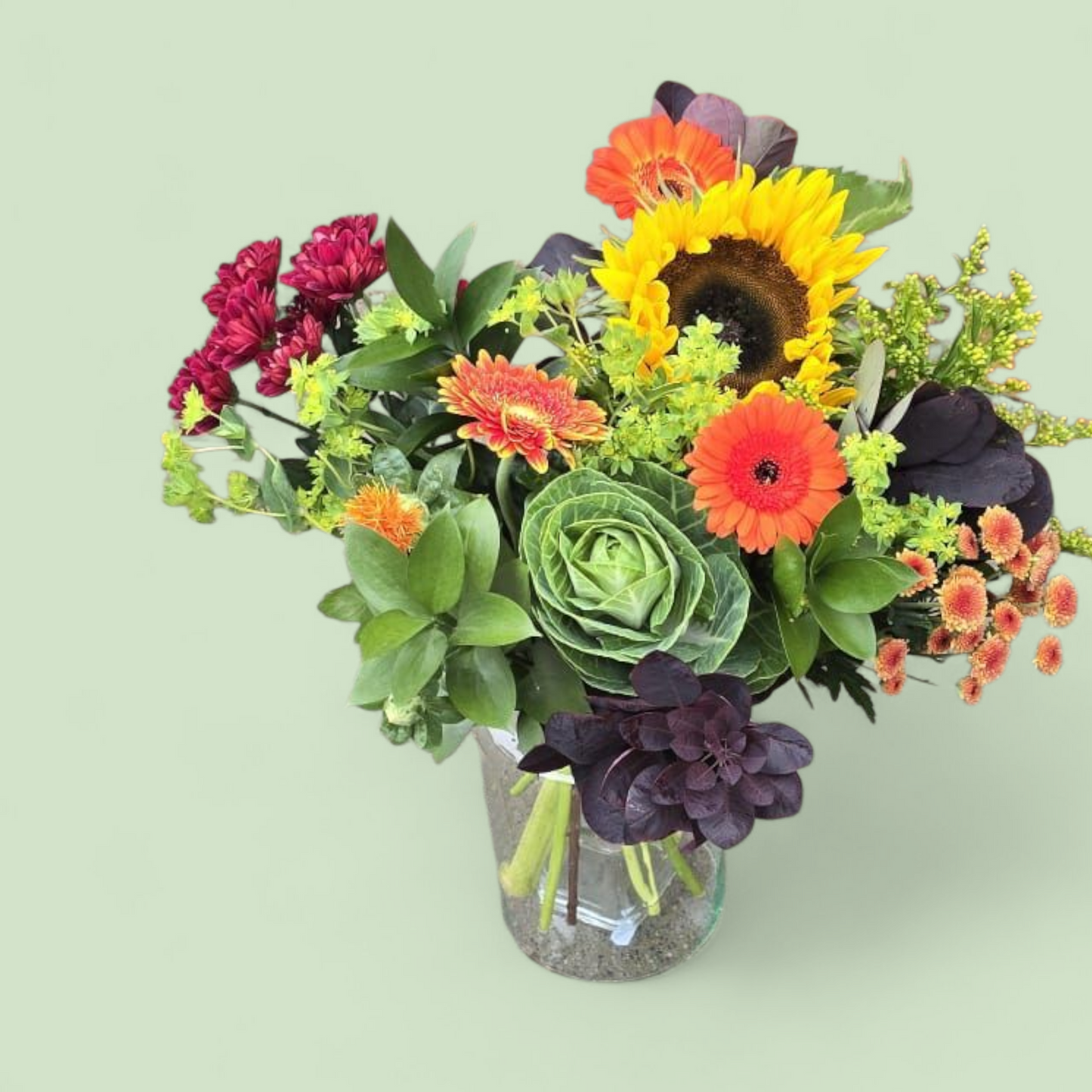 Herfstboeket “Zonnige Touch” – rood, oranje & groen met zonnebloem